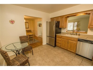 Eat in kitchen with ceramic tile flooring open to 
