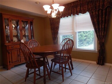 The dining room is accessible from both the kitchen and the great room.