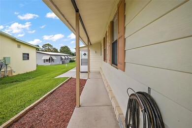 Side walk to workshop/storage area and to back of property