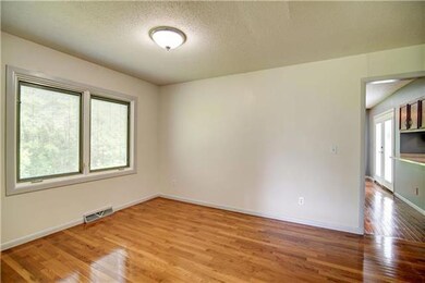 Dining room with large windows allowing natural li