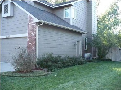 NORTH SIDE OF HOME WITH BACKYARD ENTRANCE