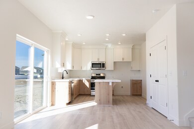 Dining area with large sliding glass door and pantry.