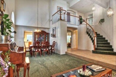 Beautiful sweeping staircase and tile entry