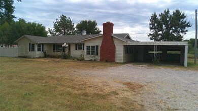 Ranch-style house featuring a carport and a front 