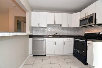 Beautiful tiled breakfast bar and backsplash!