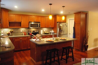 Open kitchen with Maple cabinets, soft close drawe