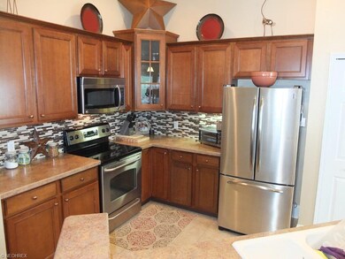 Beautiful kitchen with tile backsplash, pantry and