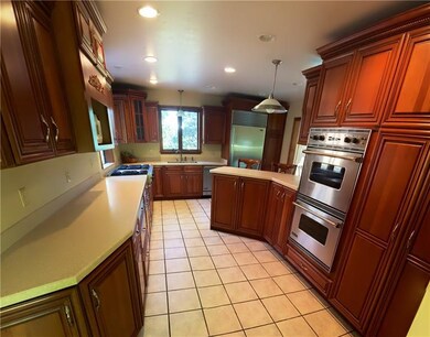 Kitchen with loads of cupboards and counter space.