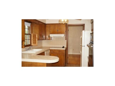 Kitchen w/tiled counters, backsplash and floors...