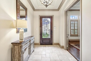 Entrance foyer with light hardwood / wood-style fl