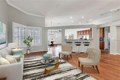 Open floor plan with beautiful wood floors, crown 