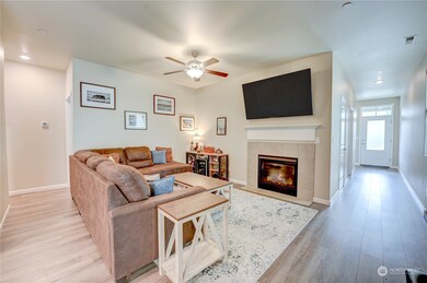 Living room with view down to the large entryway.