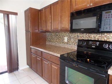 TILE BACK SPLASH*WOOD CABINETS*NEWER APPLIANCES