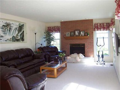 Family Room  Family room has neutral carpet, gas f