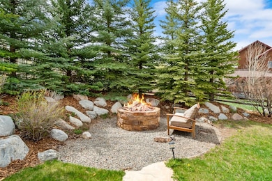 View of yard featuring an outdoor fire pit