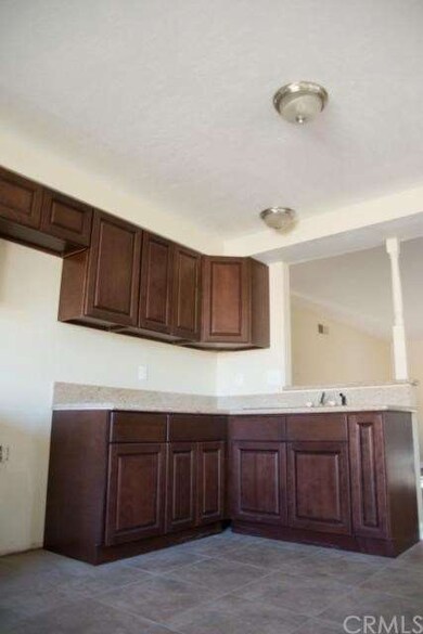 Cappuccino cabinetry with light tone granite! 