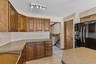 The pantry is next to the refrigerator and provides ample spaces for snacks and small kitchen appliances.