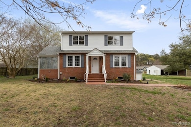 Traditional-style house with brick siding, a front