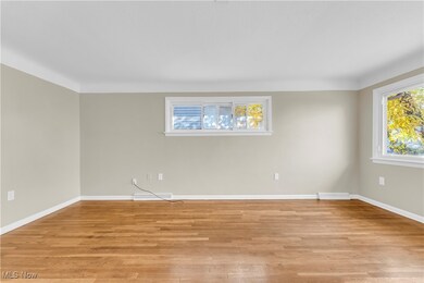 Unfurnished room with light wood-type flooring and a healthy amount of sunlight