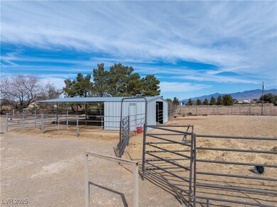 View of stable with a rural view and a mountain vi
