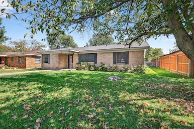 View of front of home featuring brick siding