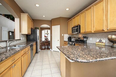 You will love this gourmet kitchen with granite counters and plenty of cabinet space.  This area is perfect for cooking family meals.