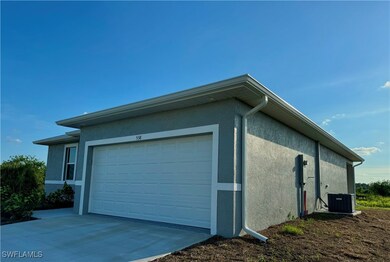 Garage with central air condition unit and concret