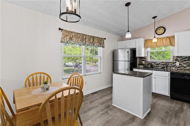 Pretty eat-in kitchen updated with granite counter