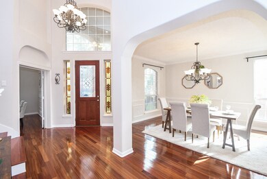 This inviting entryway features a rich wood door w