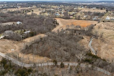 Birds eye view of property featuring a rural view