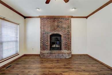 Floor to ceiling brick frames the wood burning bri