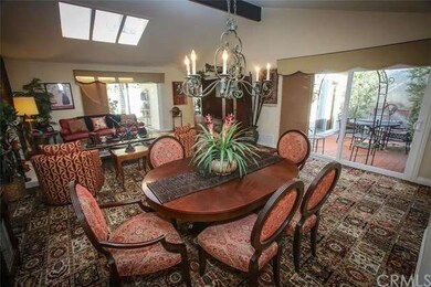 The formal dining room features a vaulted and smoo