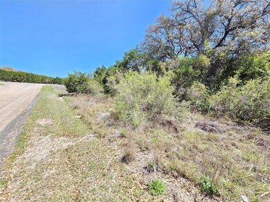 Front street view standing at property line looking East to corner