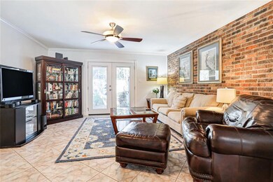 Living room with French doors leading to your priv