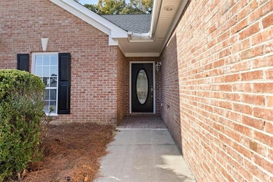 Entrance to property with brick siding
