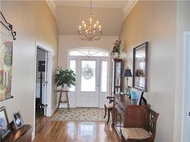 WOW! What a stunning entrance!  Tall ceilings and hardwood flooring.
