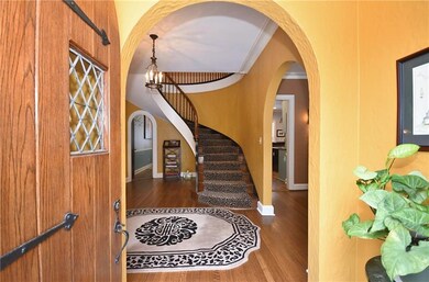 Arched doorways lead into grand entry.