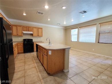 Kitchen with black appliances, under cabinet range