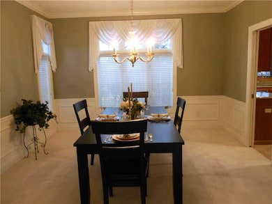Dining Room. Crown molding -- natural light with b