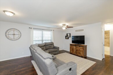 Great Room with Laminate Flooring and Ceiling Fan