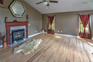 Living room, fireplace place with gas logs, laminate hardwood flooring