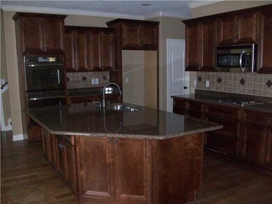 Great kitchen with custom babinets, granite tops a