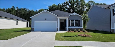 Craftsman-style house with a front yard