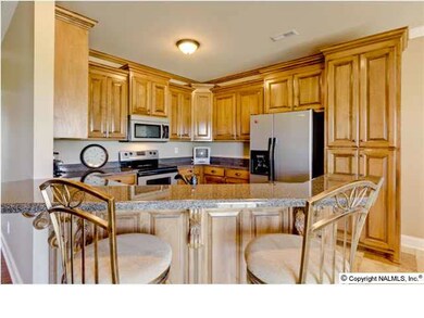 Open Kitchen with GORGEOUS Cabinets, Stainless Appliances, Bronzed Fixtures & Tile Flooring