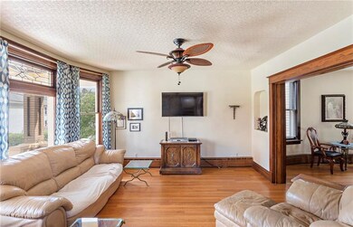 Living room with decorative bay window featuring c