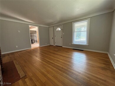 Entryway with hardwood / wood-style flooring