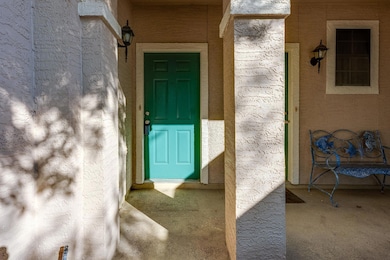 Entrance to property with stucco siding