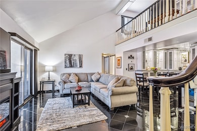 Living room with high vaulted ceiling