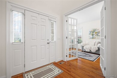 Foyer entrance featuring hardwood flooring