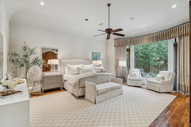 The main floor primary bedroom
offers elegance an